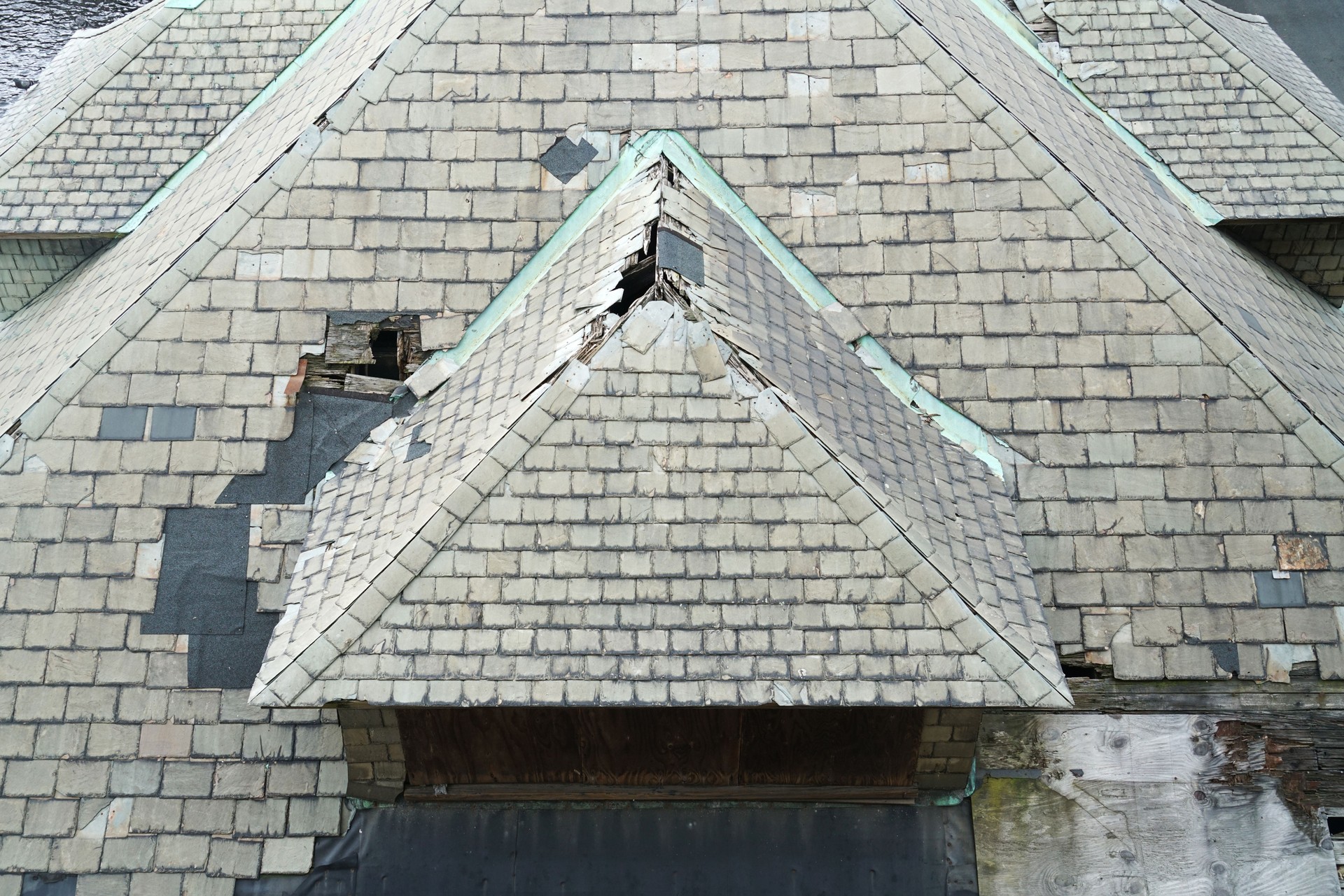 old damaged shingle on the roof